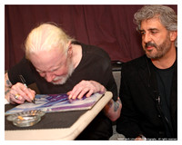 Johnny Winter signing on the bus with Barry